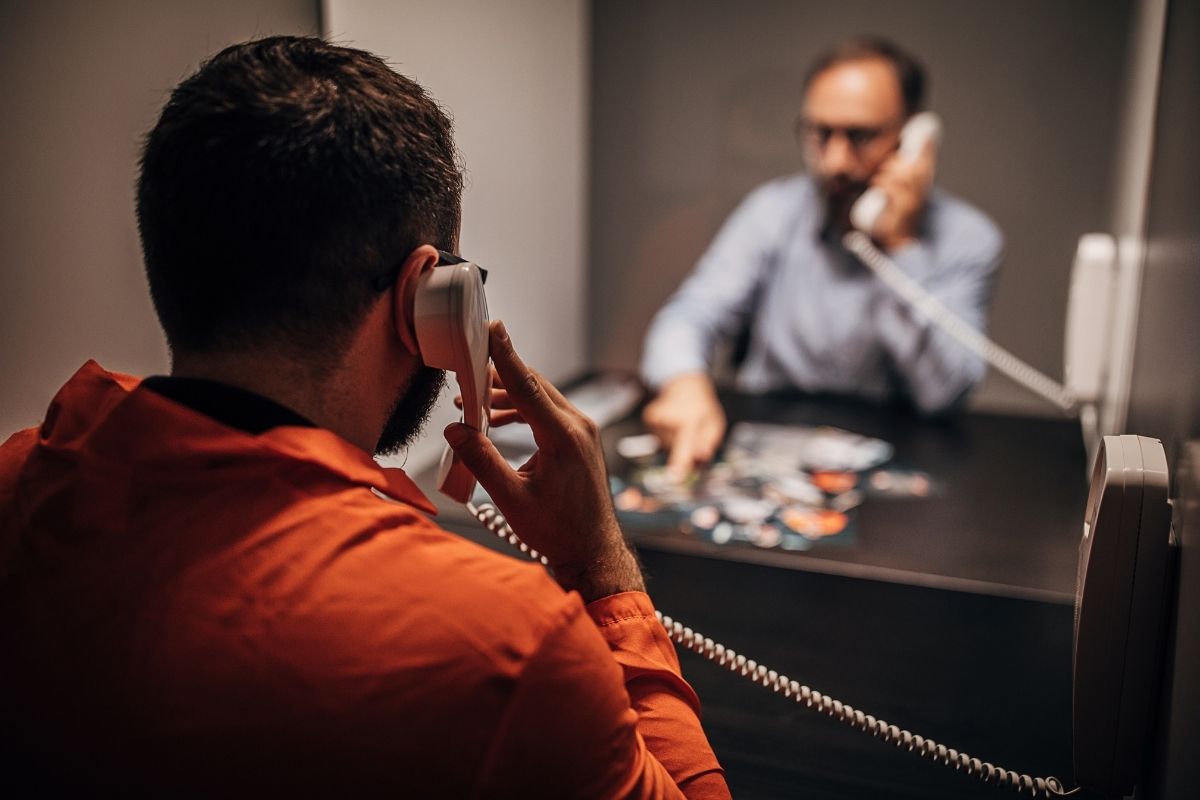 inmate talking to a prison consultant via prison telephone