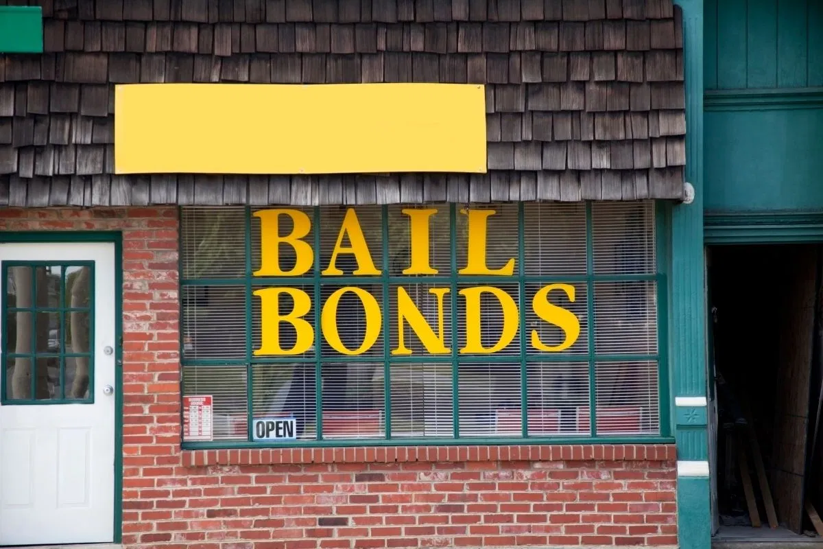 A bail bond agent's window signage.