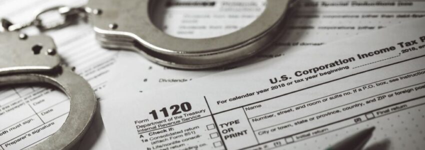 A pair of handcuffs on top of a tax declaration form.