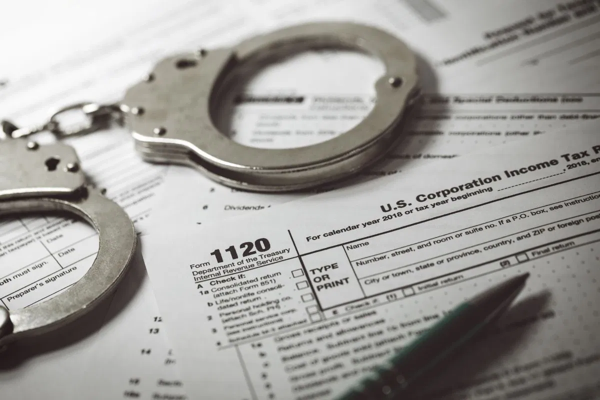 A pair of handcuffs on top of a tax declaration form.