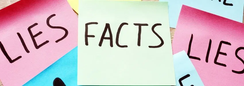 A photo of sticky notes saying lies, facts, and lies.