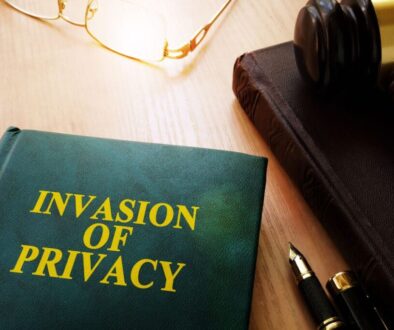 A book titled Invasion of Privacy with a gavel beside it.