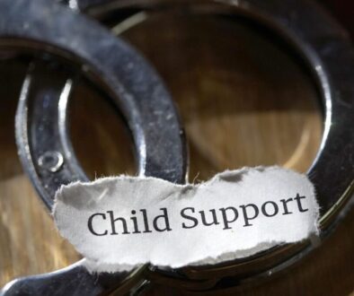 A photo warning parents about child support fraud.