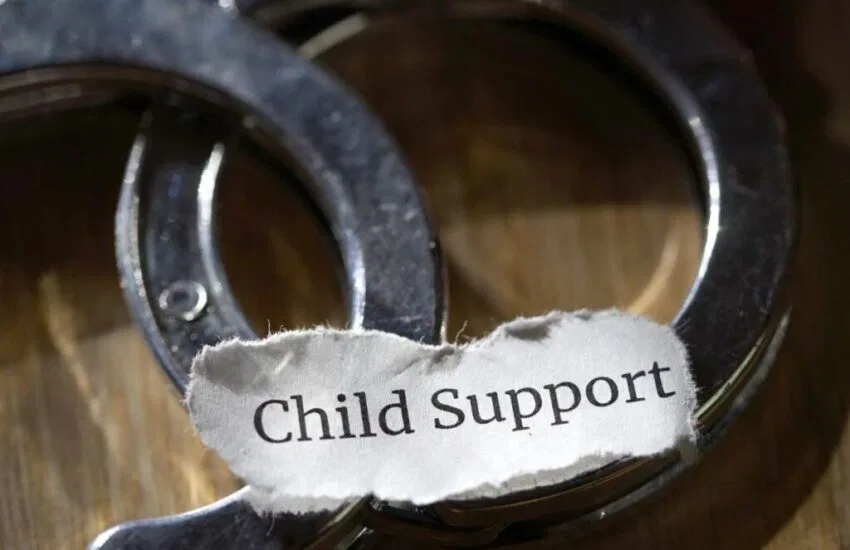 A photo warning parents about child support fraud.